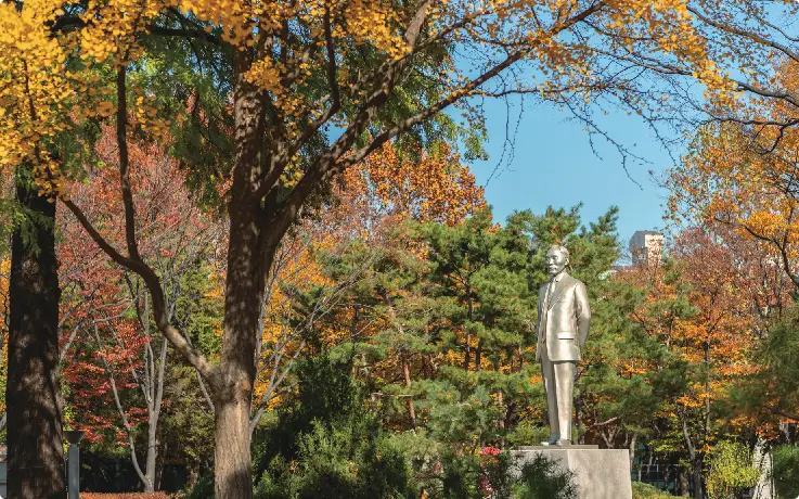 Peaceful Dosan Park surrounded by trees and modern cafes in Apgujeong, Seoul